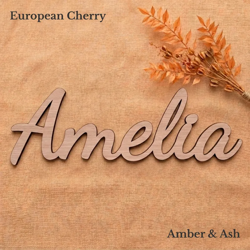 Amelia name sign in the Swirly font, in European cherry veneer